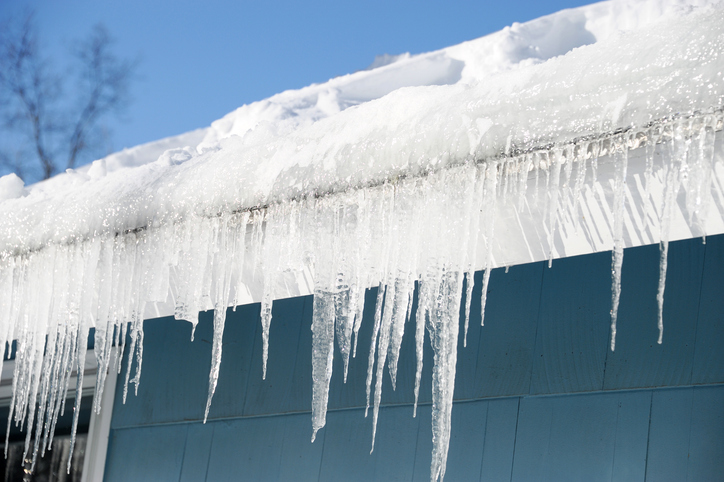 Ice buildup causing an ice dam on a roof