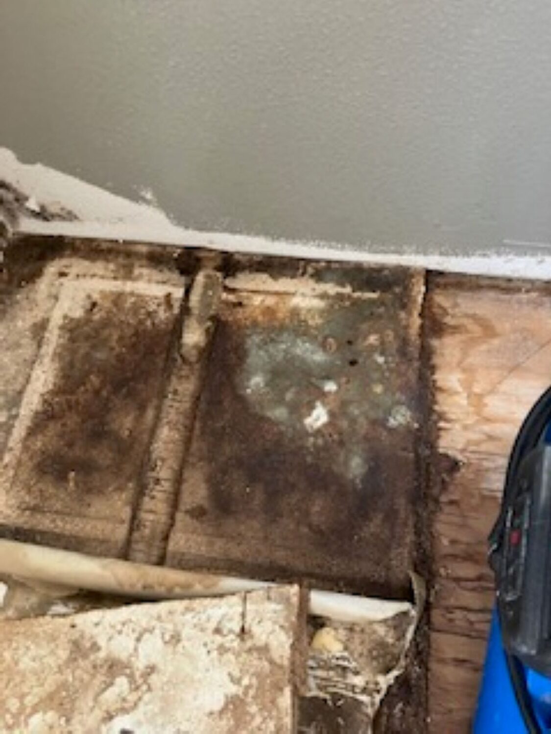 Water damaged kitchen with drying equipment set up by restoration crew