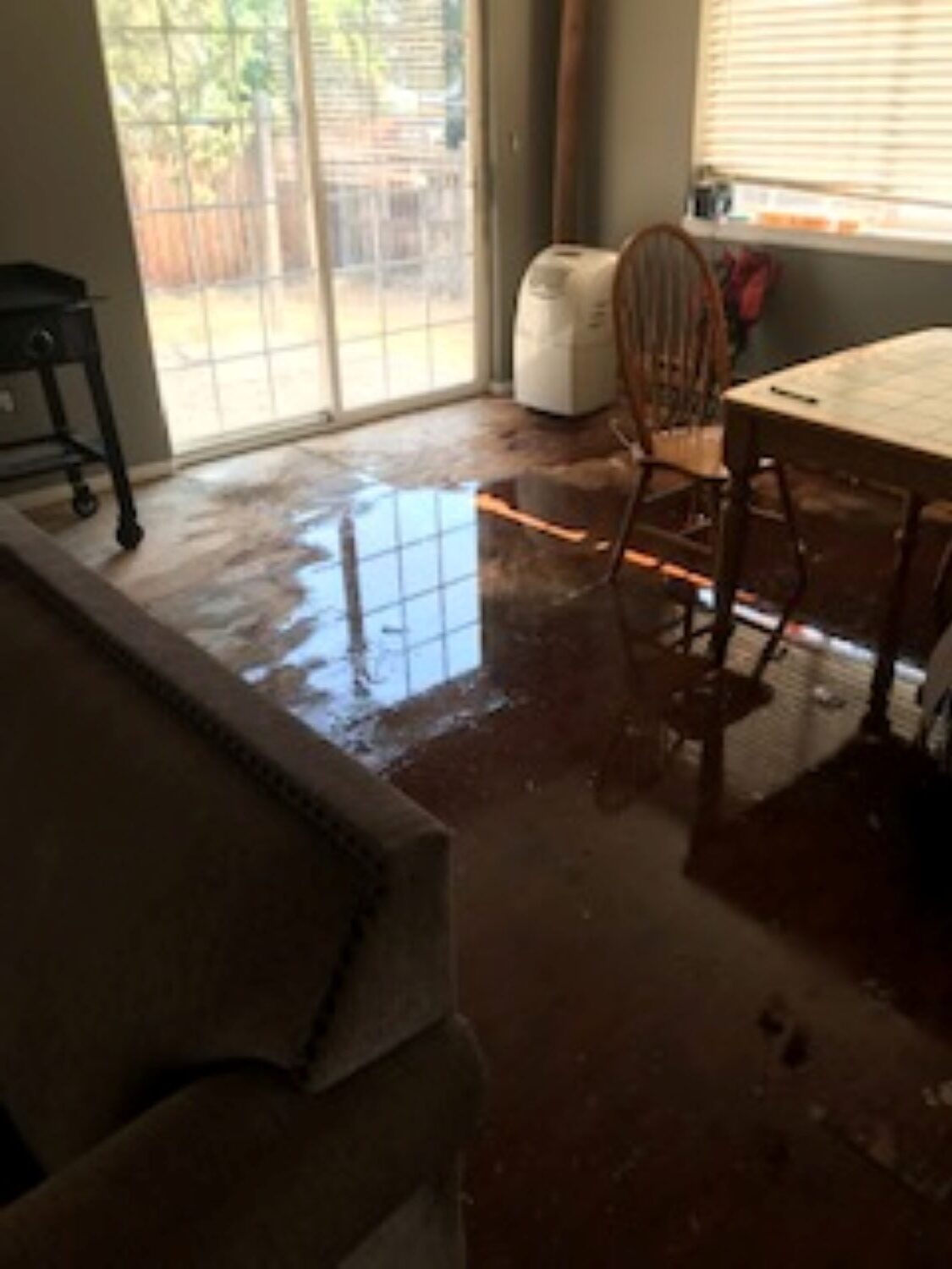 Kitchen water damage from supply line leak in Madras Oregon home