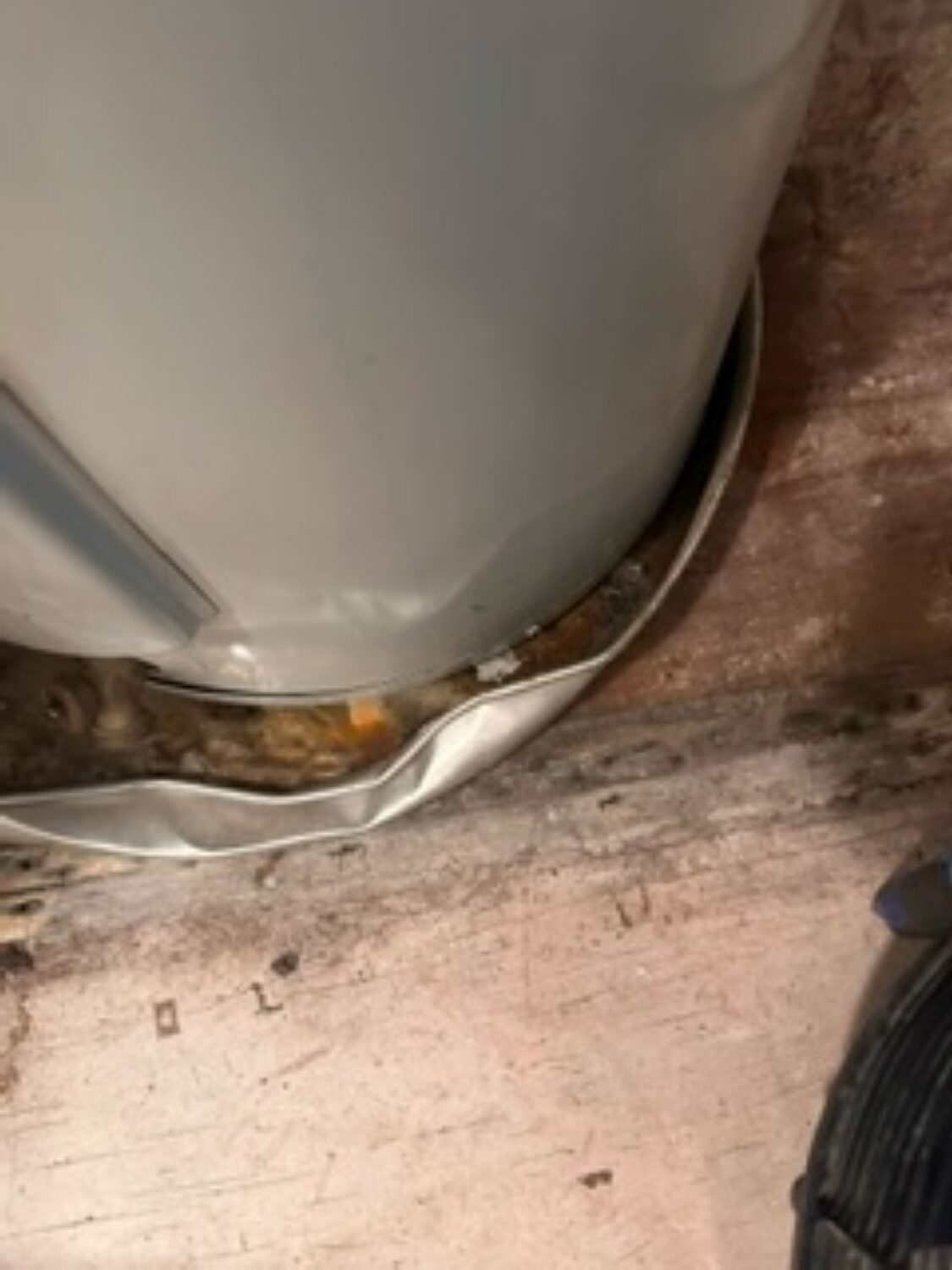 Water heater area showing water damage in residential home