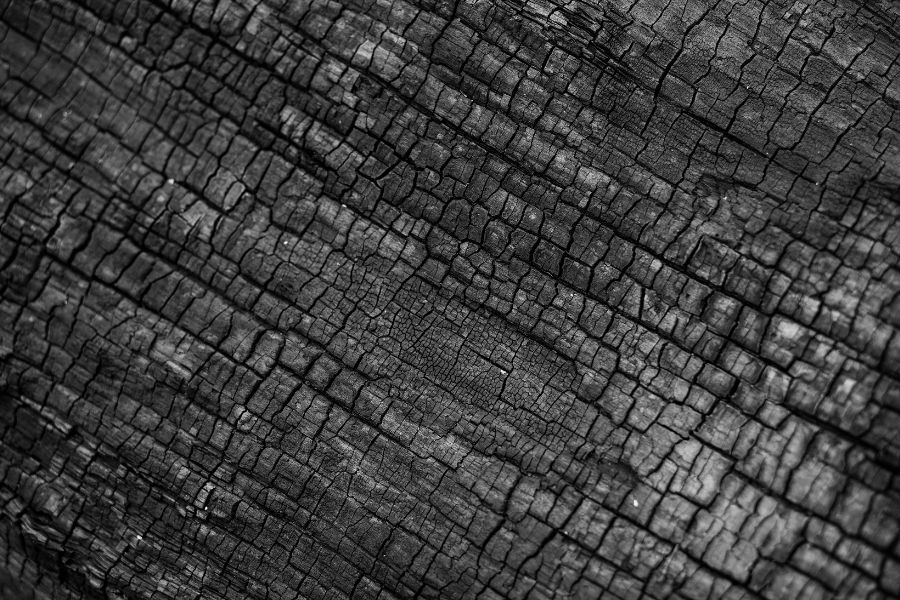 Charred structural materials inside a fire-damaged home