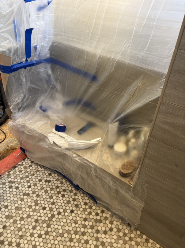Water damage visible in master bathroom floor tile in Bend Oregon
