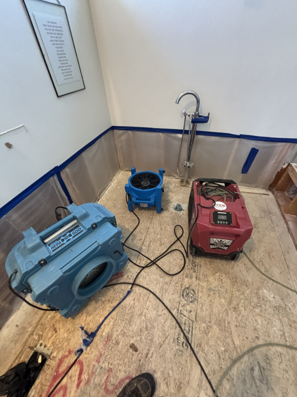 Drying equipment running in water damaged bathroom during mitigation in Bend OR