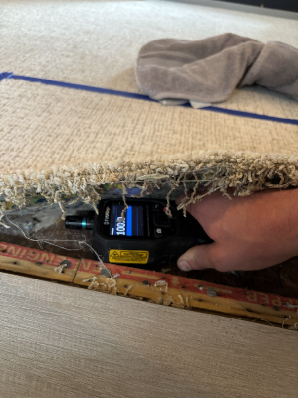 Exposed subfloor and framing after bathtub drain water damage cleanup Bend OR