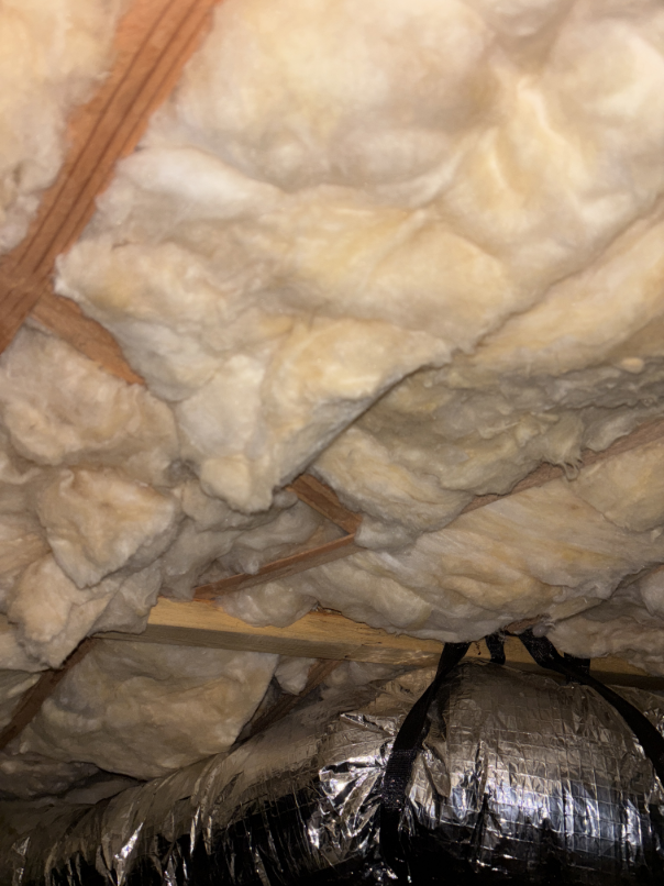 New R-30 batt insulation installed in crawlspace after water damage restoration