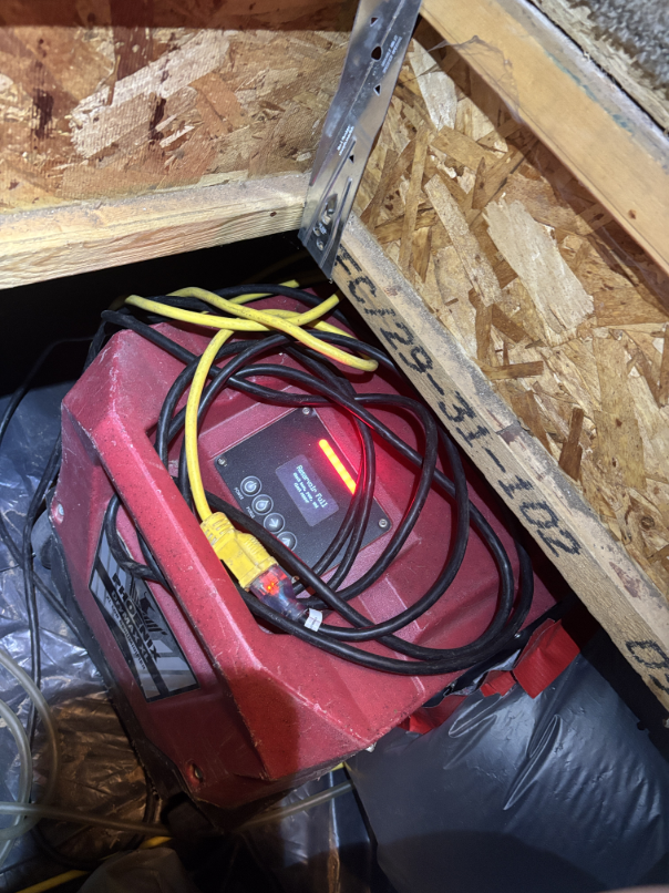 Wet insulation removal in crawl space during water damage mitigation