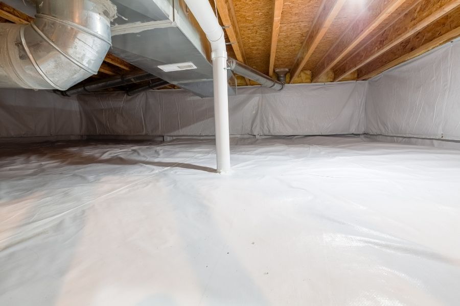 Crawl space with a vapor barrier installed to prevent moisture intrusion in a Central Oregon home