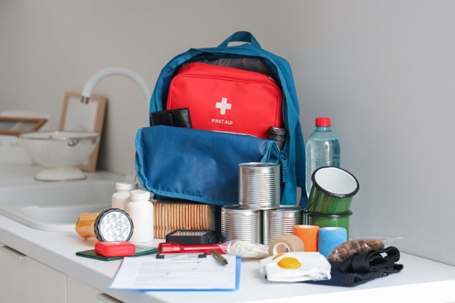 Emergency go-bag packed with documents and supplies ready for wildfire evacuation