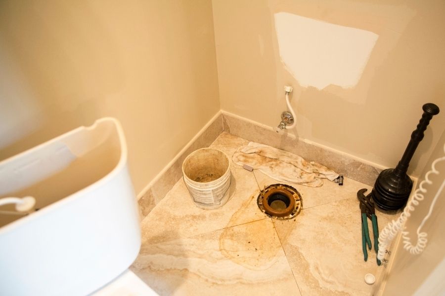 Sewage backup damage inside a Prineville home showing contaminated water on flooring