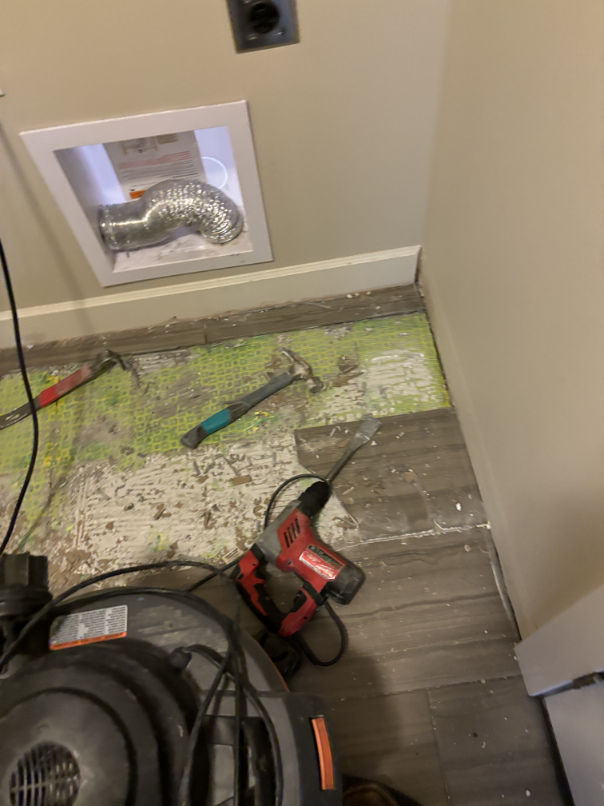Carpet and carpet pad removed from water-damaged bedroom