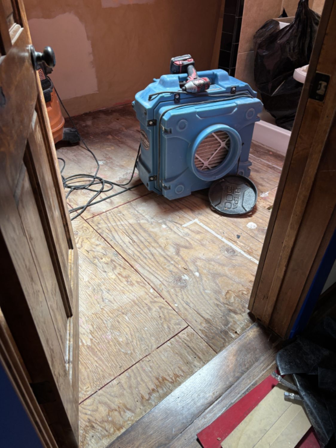 HEPA air scrubber running during water damage mitigation in Bend home