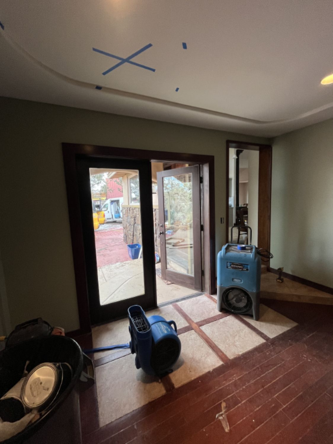 Bathroom floor during water damage restoration with tile and mortar bed removed