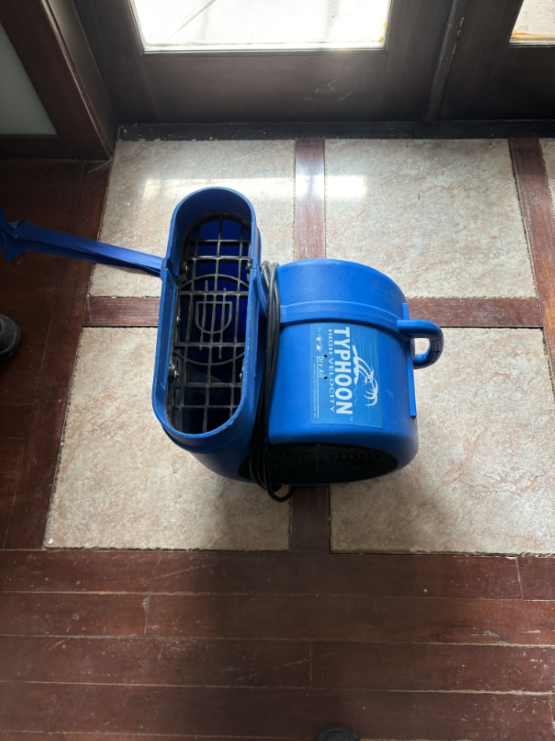 Subfloor exposed and cleaned after water damage restoration in bathroom