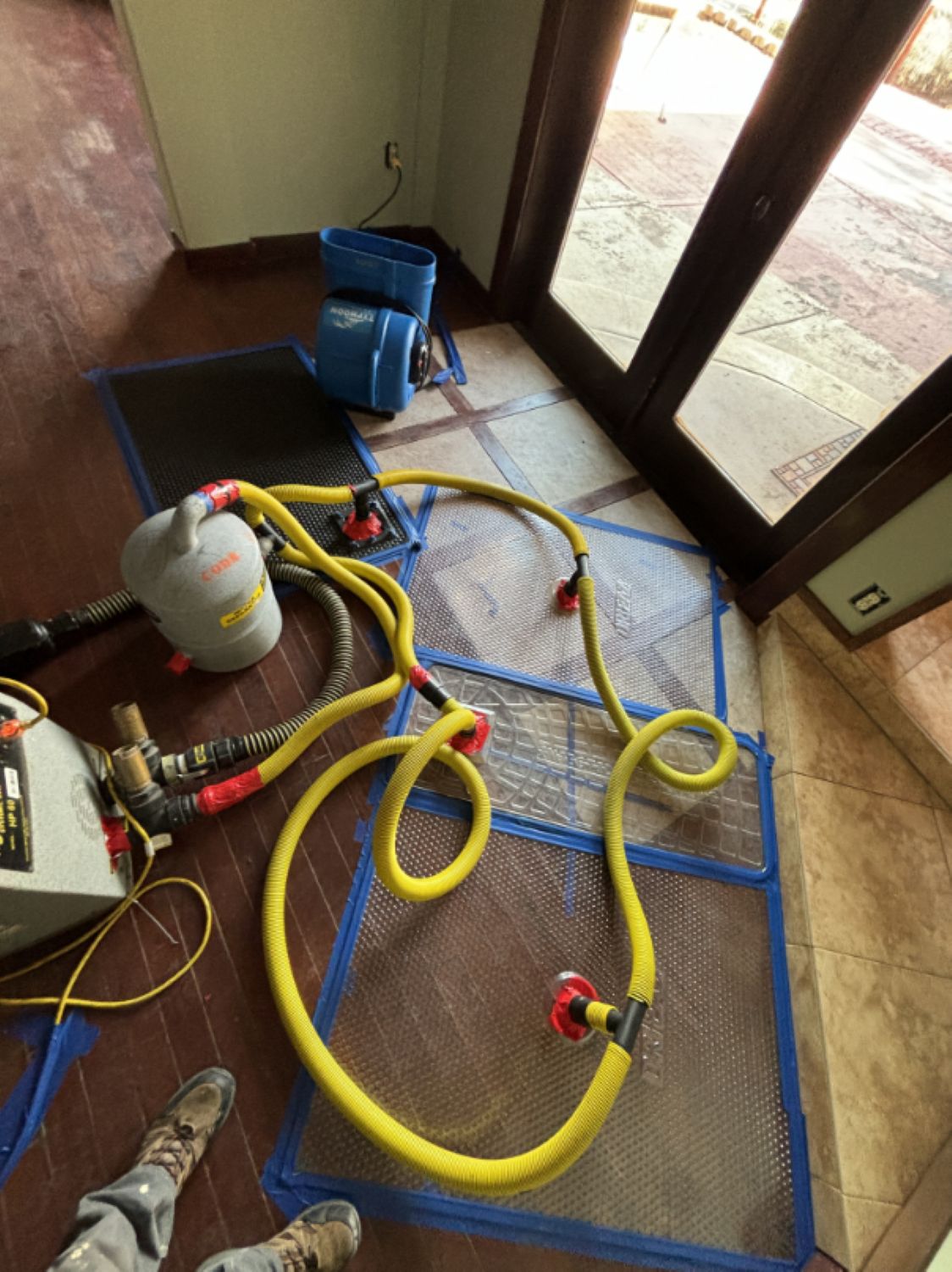 Injectidry system used for drying hardwood floors during water damage mitigation