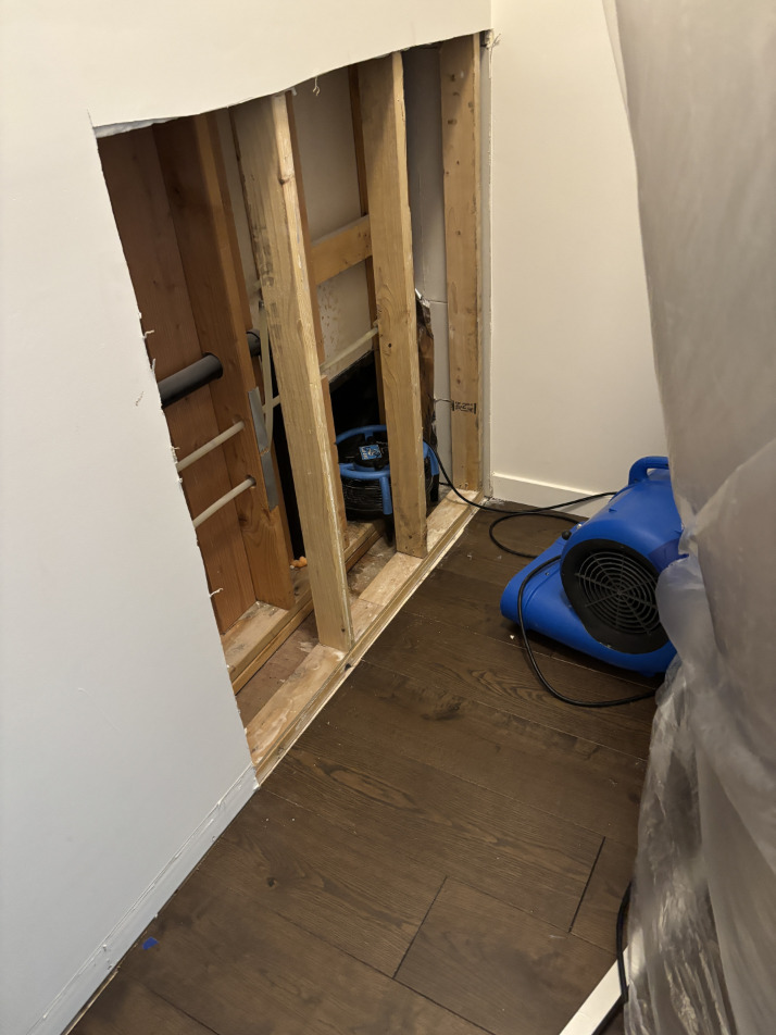 Air movers positioned along walls for thorough structural drying in Bend condo