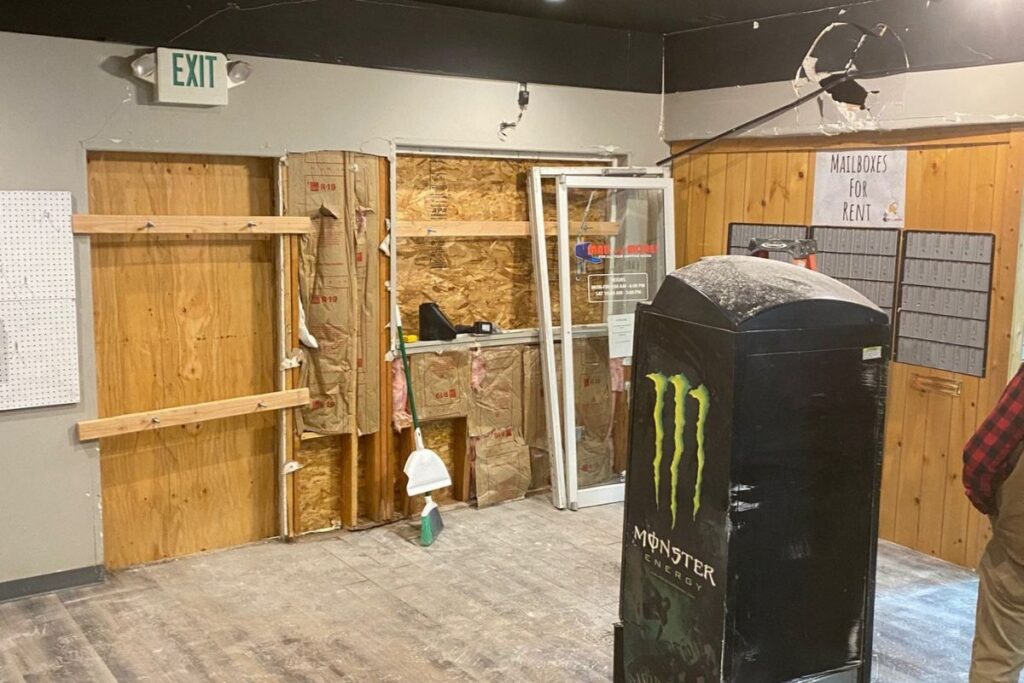 Business interior boarded up after damage in Bend, OR